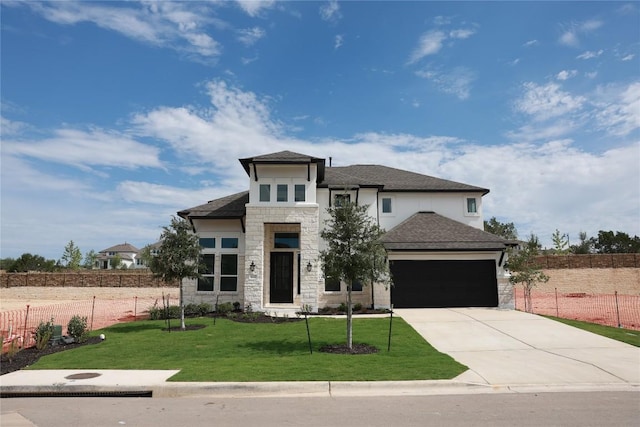 5337 Olimpico Way, Leander, TX 78641 - view of front of home with stone siding, a garage, driveway, stucco siding, and a shingled roof