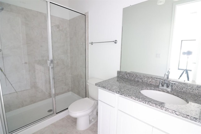 5337 Olimpico Way, Leander, TX 78641 - bathroom featuring toilet, vanity, a shower stall, and tile patterned flooring