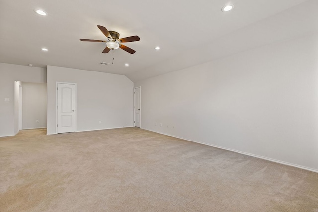 113 Blossom Valley Strm, Buda, TX 78610 - empty room featuring light carpet, ceiling fan, recessed lighting, baseboards, and lofted ceiling