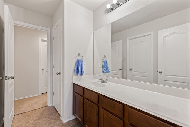 113 Blossom Valley Strm, Buda, TX 78610 - bathroom featuring vanity and baseboards