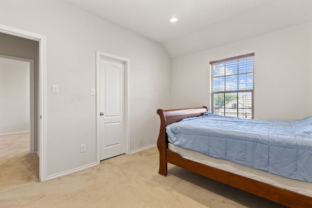113 Blossom Valley Strm, Buda, TX 78610 - bedroom with light carpet, lofted ceiling, baseboards, and recessed lighting