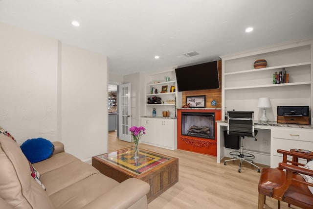 1507 Ash St, Georgetown, TX 78626 - living area with light wood-type flooring, recessed lighting, and built in features