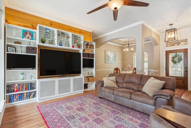 119 Tallwood Cir, Salado, TX 76571 - living area with a chandelier, arched walkways, crown molding, wood finished floors, and ceiling fan