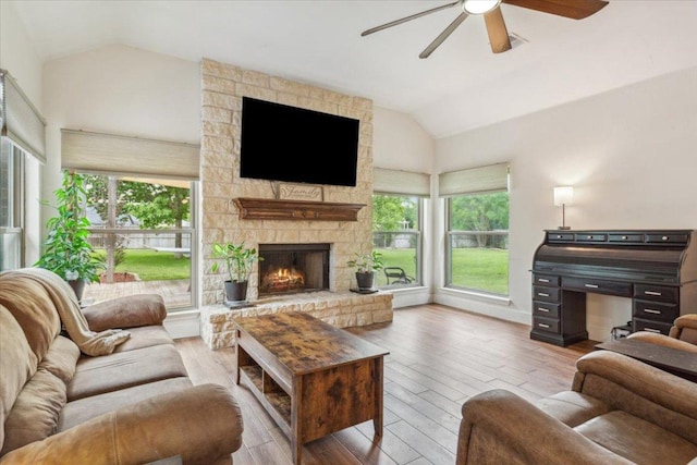 119 Tallwood Cir, Salado, TX 76571 - living area featuring vaulted ceiling, ceiling fan, wood finished floors, and a stone fireplace