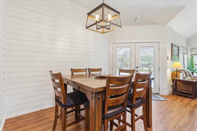119 Tallwood Cir, Salado, TX 76571 - dining room featuring french doors, light wood-style flooring, a chandelier, and baseboards