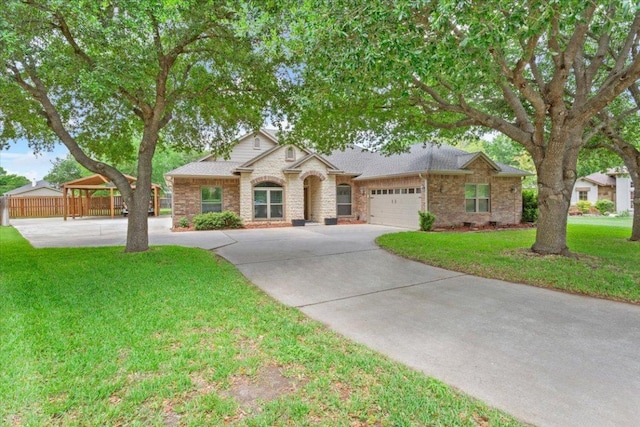 119 Tallwood Cir, Salado, TX 76571 - view of front facade featuring driveway, a garage, and brick siding