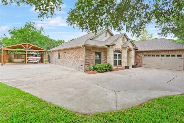 119 Tallwood Cir, Salado, TX 76571 - view of front facade featuring driveway, roof with shingles, brick siding, and a garage
