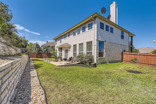 7701 Crackling Creek Dr, Austin, TX 78736 - back of property with a patio area and a chimney