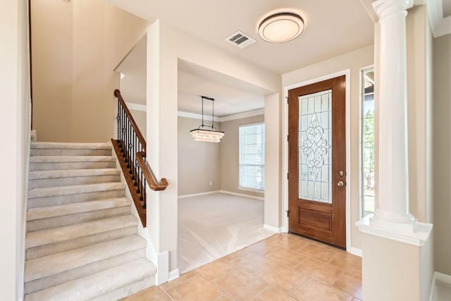 7701 Crackling Creek Dr, Austin, TX 78736 - entryway featuring stairs, light colored carpet, ornate columns, and light tile patterned flooring