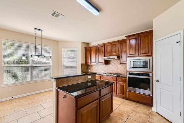 7701 Crackling Creek Dr, Austin, TX 78736 - kitchen with appliances with stainless steel finishes, a center island, decorative backsplash, and light tile patterned flooring