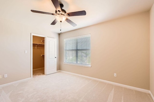 7701 Crackling Creek Dr, Austin, TX 78736 - unfurnished bedroom with light carpet, a walk in closet, and ceiling fan