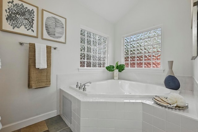 905 Juanita St, Austin, TX 78704 - full bath featuring a bath, lofted ceiling, and tile patterned floors