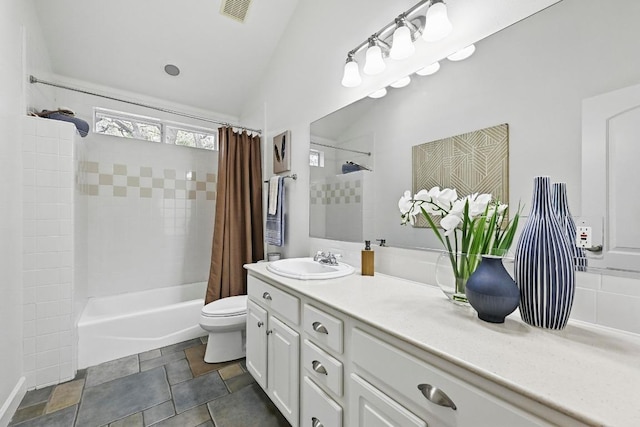 905 Juanita St, Austin, TX 78704 - full bathroom with vanity, shower / tub combo with curtain, toilet, and vaulted ceiling