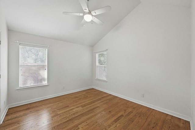 905 Juanita St, Austin, TX 78704 - unfurnished room featuring lofted ceiling, wood finished floors, and baseboards