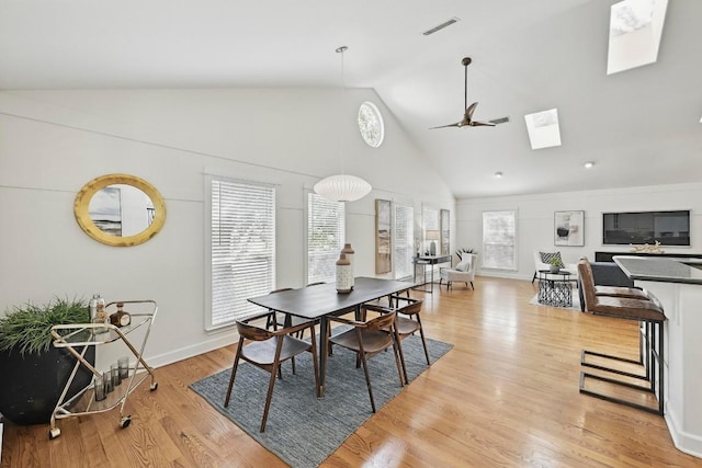 905 Juanita St, Austin, TX 78704 - dining space with a skylight, high vaulted ceiling, light wood-style floors, and ceiling fan