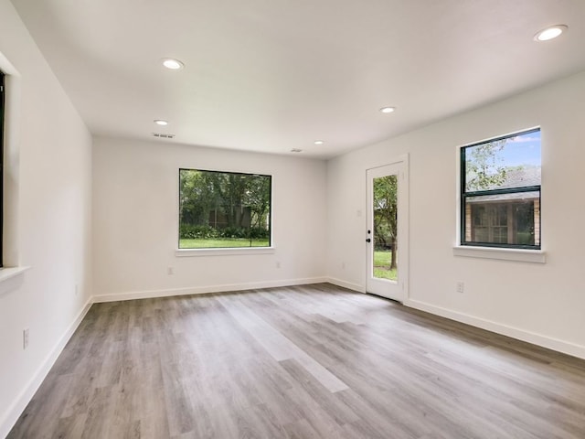 3304 Windsor Rd, Austin, TX 78703 - spare room with wood finished floors and recessed lighting