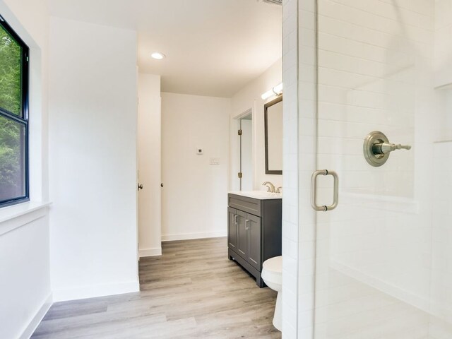 3304 Windsor Rd, Austin, TX 78703 - full bath featuring a stall shower, vanity, wood finished floors, and recessed lighting