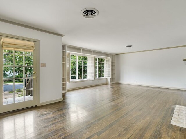 3304 Windsor Rd, Austin, TX 78703 - empty room with wood finished floors and baseboards