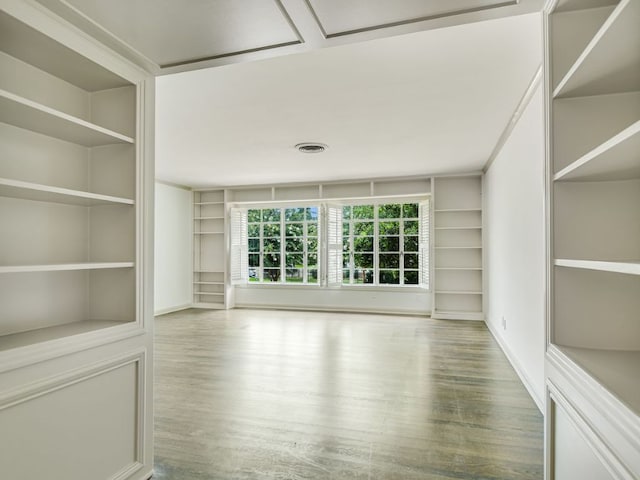3304 Windsor Rd, Austin, TX 78703 - spare room with built in features and wood finished floors