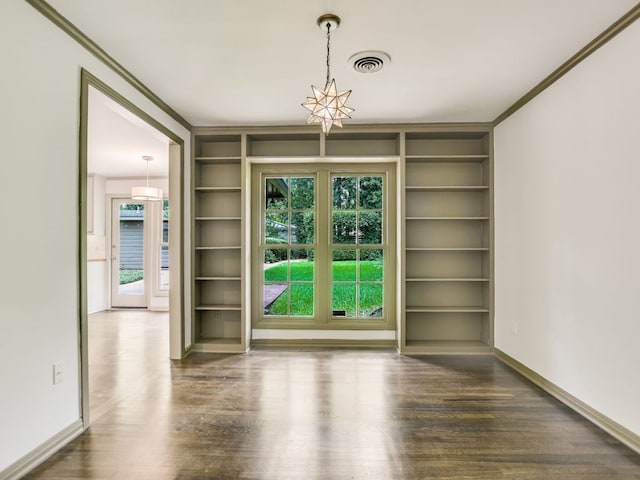 3304 Windsor Rd, Austin, TX 78703 - unfurnished dining area featuring built in features, wood finished floors, ornamental molding, and a chandelier