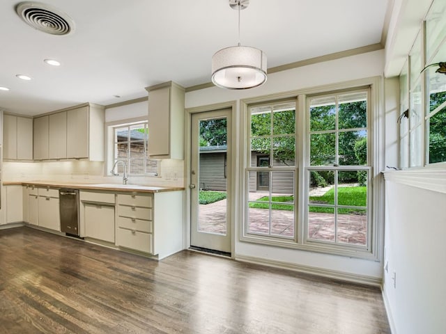 3304 Windsor Rd, Austin, TX 78703 - kitchen with backsplash, light countertops, dark wood-type flooring, recessed lighting, and ornamental molding