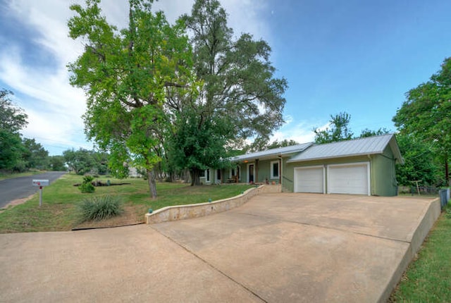 5606 Longhorn Lndg, Austin, TX 78734 - ranch-style house with a garage, a front yard, driveway, a porch, and metal roof