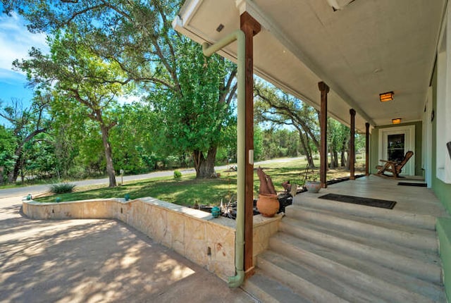 5606 Longhorn Lndg, Austin, TX 78734 - porch featuring view of wooded area