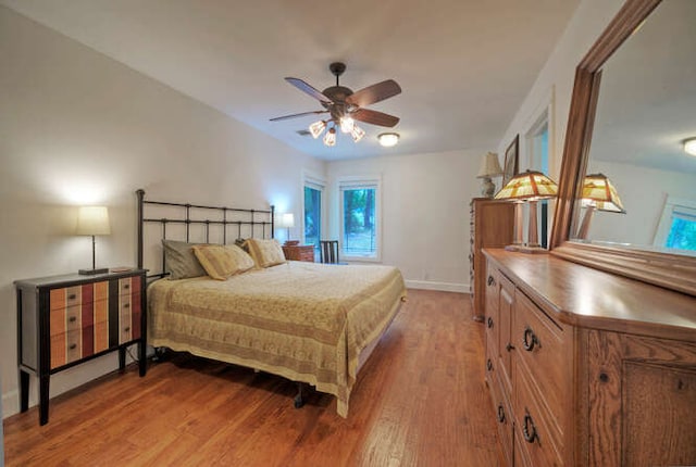 5606 Longhorn Lndg, Austin, TX 78734 - bedroom featuring light wood-style flooring, baseboards, and ceiling fan