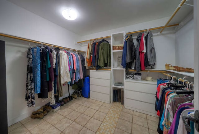 5606 Longhorn Lndg, Austin, TX 78734 - walk in closet with light tile patterned floors