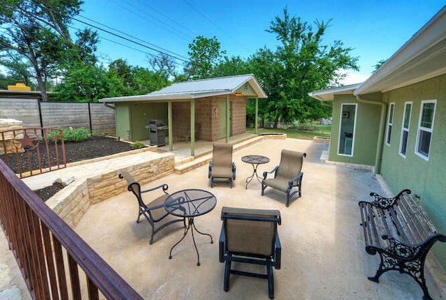 5606 Longhorn Lndg, Austin, TX 78734 - fenced backyard with grilling area, a patio area, and an outdoor structure