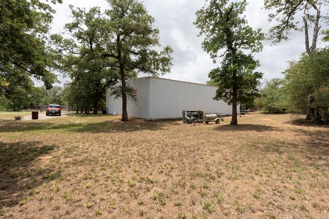 966 County Road 439th Rd, Stockdale, TX 78160 - view of green lawn with a pole building and an outbuilding