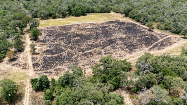 966 County Road 439th Rd, Stockdale, TX 78160 - aerial view of property and surrounding area featuring a forest and rural landscape