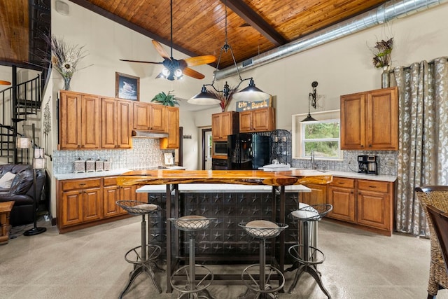 966 County Road 439th Rd, Stockdale, TX 78160 - kitchen with wood ceiling, light carpet, high vaulted ceiling, freestanding refrigerator, and light countertops