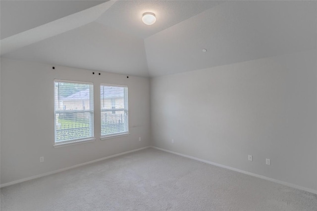 2800 Joe Dimaggio Blvd Unit 95, Round Rock, TX 78665 - spare room featuring carpet flooring, baseboards, and vaulted ceiling