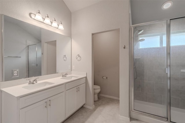 2800 Joe Dimaggio Blvd Unit 95, Round Rock, TX 78665 - full bathroom featuring toilet, a stall shower, double vanity, baseboards, and tile patterned flooring