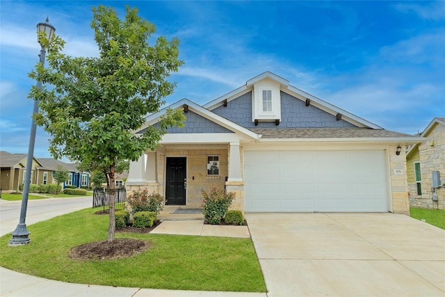 2800 Joe Dimaggio Blvd Unit 95, Round Rock, TX 78665 - craftsman inspired home with a front lawn, driveway, a garage, stone siding, and a shingled roof