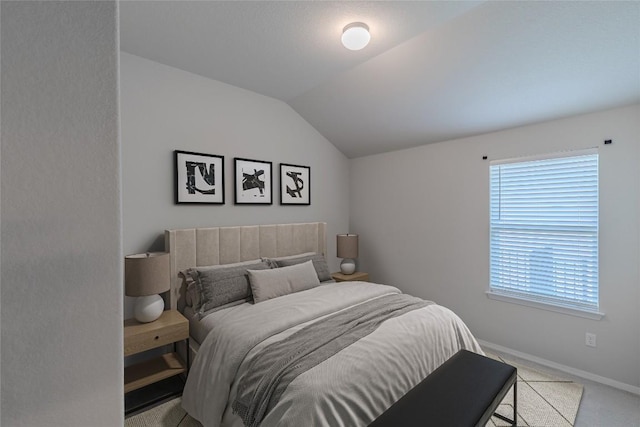 2800 Joe Dimaggio Blvd Unit 95, Round Rock, TX 78665 - carpeted bedroom featuring vaulted ceiling and baseboards