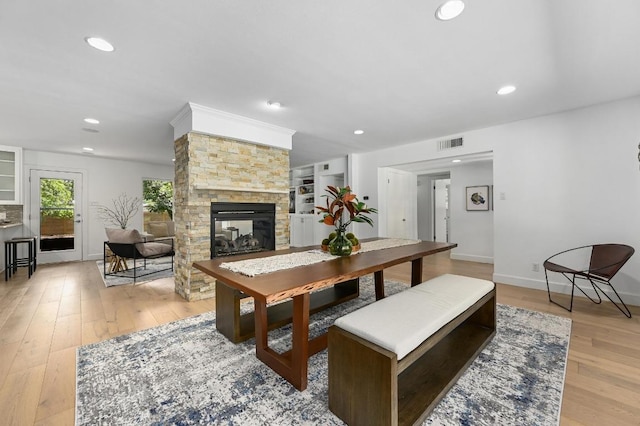 1802 Corona Dr, Austin, TX 78723 - living area with light wood-style flooring, a fireplace, and recessed lighting