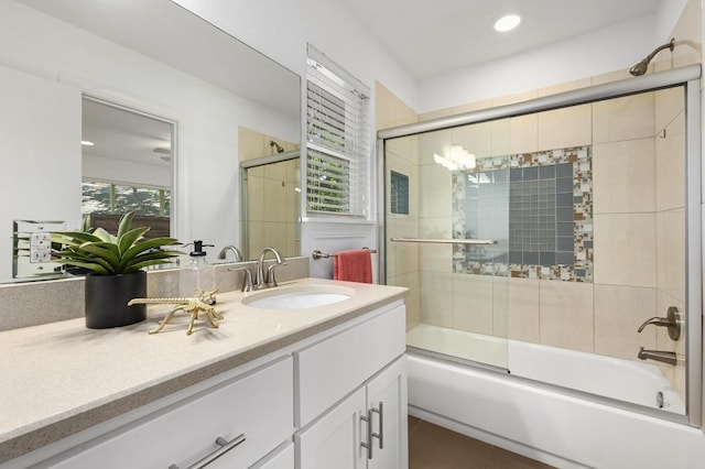 1802 Corona Dr, Austin, TX 78723 - bathroom featuring vanity, bath / shower combo with glass door, tile patterned floors, and recessed lighting