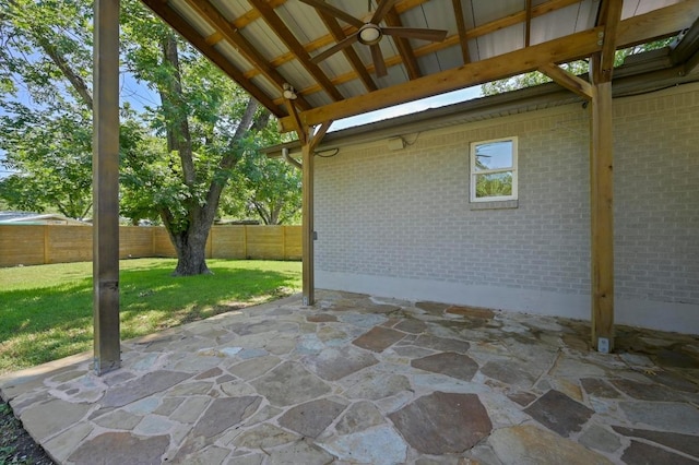 1802 Corona Dr, Austin, TX 78723 - fenced backyard featuring ceiling fan, a patio area, and a gazebo