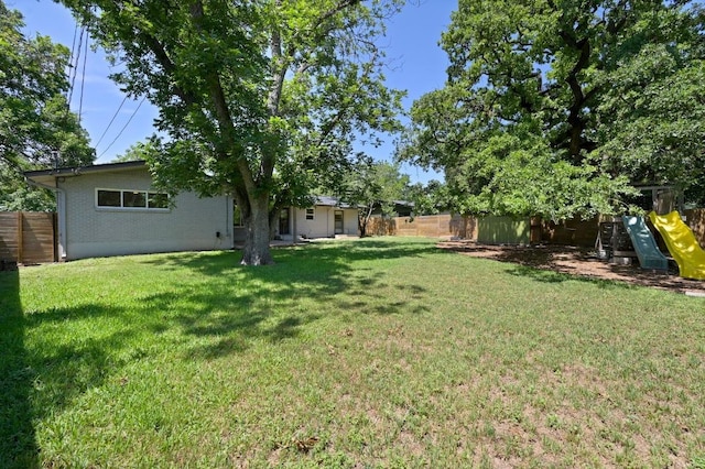 1802 Corona Dr, Austin, TX 78723 - fenced backyard with a playground