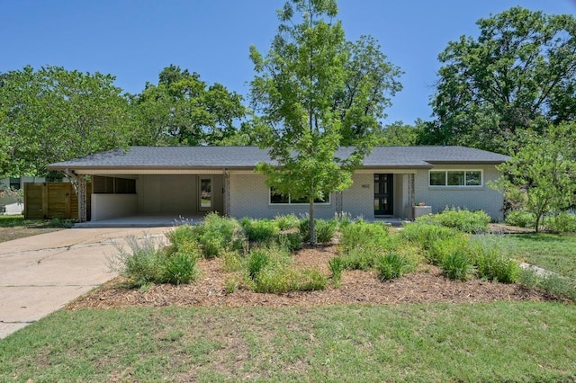 1802 Corona Dr, Austin, TX 78723 - ranch-style house featuring driveway and an attached carport