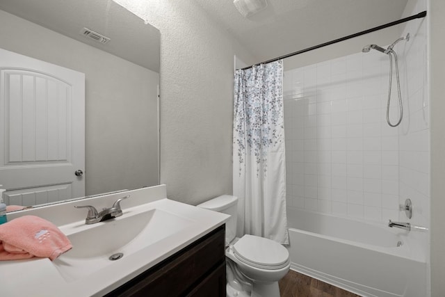 144 Sulphur River Loop, Hutto, TX 78634 - full bath featuring vanity, toilet, wood finished floors, shower / bath combination with curtain, and a textured wall