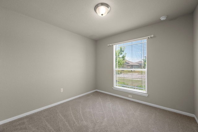 144 Sulphur River Loop, Hutto, TX 78634 - carpeted empty room with baseboards and a smoke detector