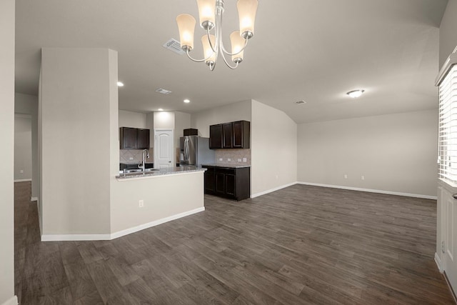 144 Sulphur River Loop, Hutto, TX 78634 - kitchen featuring open floor plan, backsplash, dark wood-type flooring, stainless steel fridge with ice dispenser, and baseboards