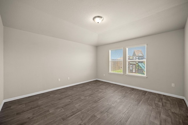 144 Sulphur River Loop, Hutto, TX 78634 - unfurnished room featuring dark wood-type flooring and baseboards