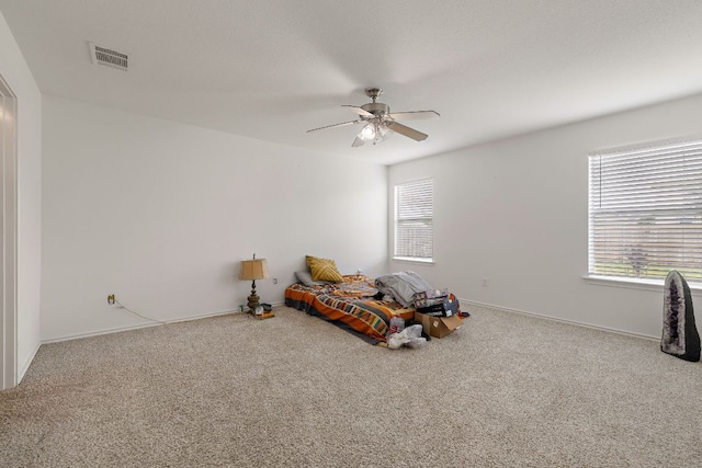 120 Wegstrom St, Hutto, TX 78634 - unfurnished bedroom with carpet, baseboards, and a ceiling fan