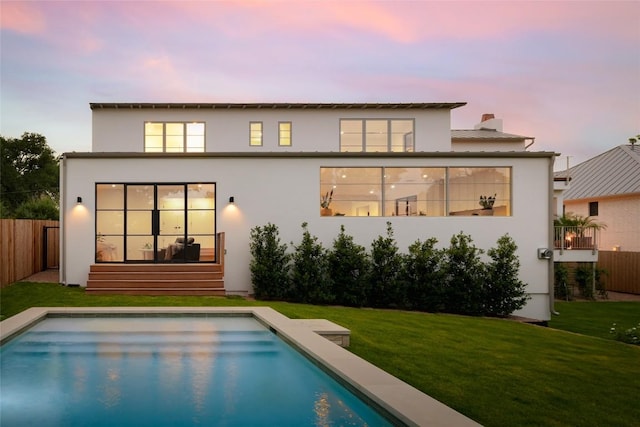 1103 Gaston Ave, Austin, TX 78703 - back of property at dusk with stucco siding and a chimney
