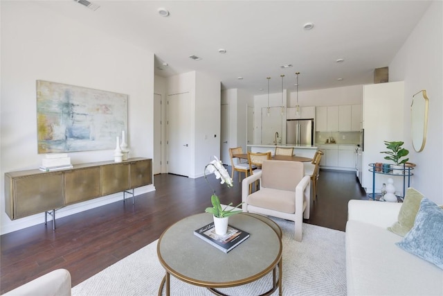 207 W Johanna St Unit 102, Austin, TX 78704 - living area with dark wood-style floors