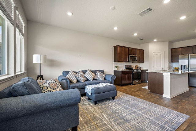 809 Cade Cv, Georgetown, TX 78626 - living room featuring recessed lighting and dark wood-style floors